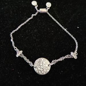 Adjustable silvertone bracelet with rhinestones